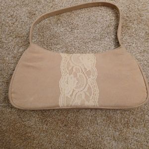 A beige creamy hand wrist purse